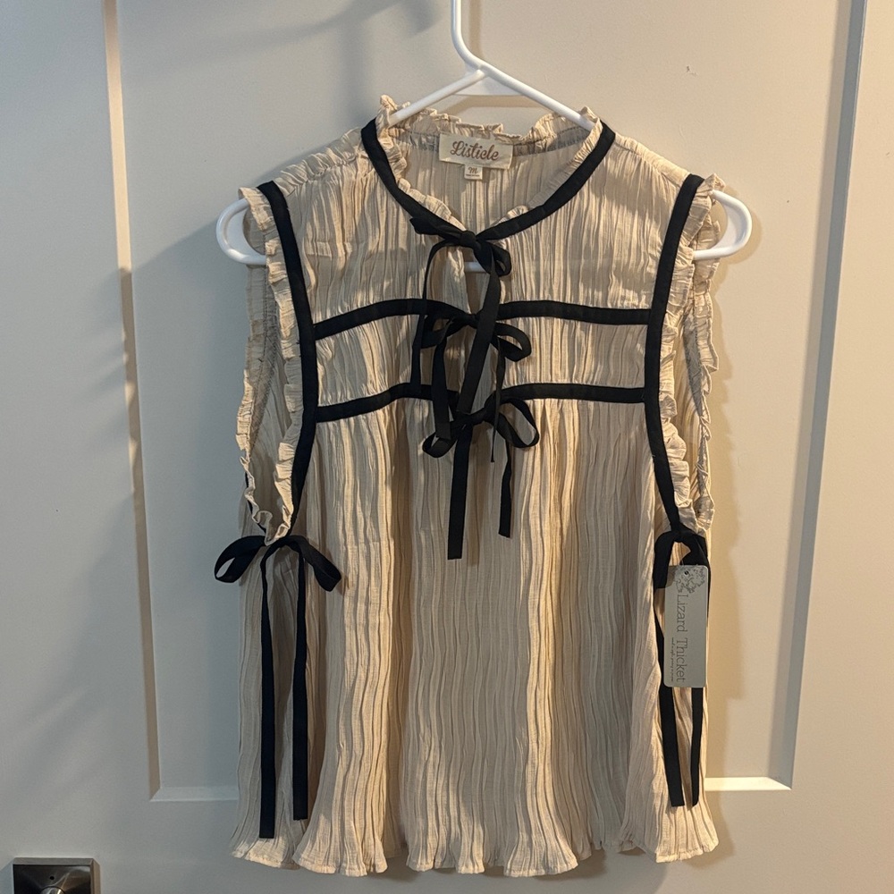 Cream Sleeveless Top with Black Bows